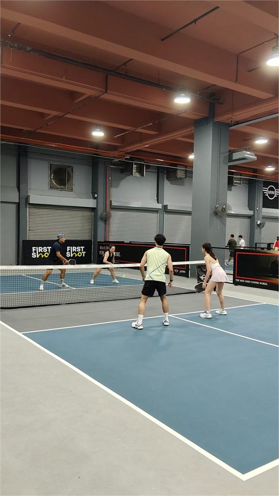 Pickleball players during a game at First Shot