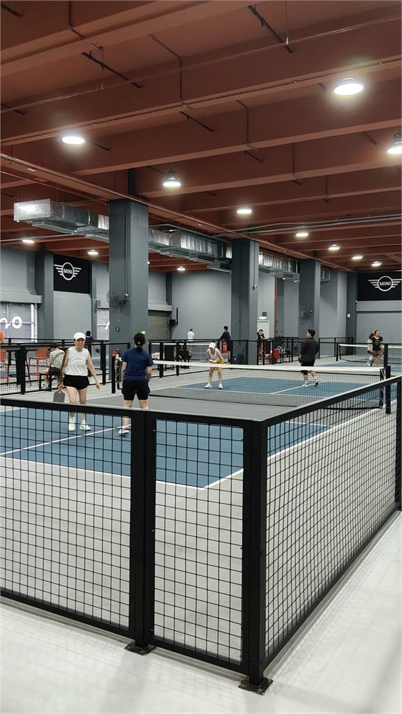 Players on the indoor pickleball courts at First Shot Petaling Jaya